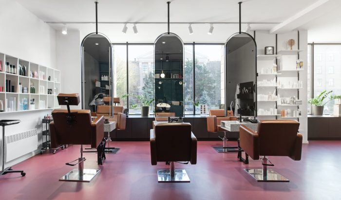 Chairs and mirrors in modern hairdressing, beauty salon